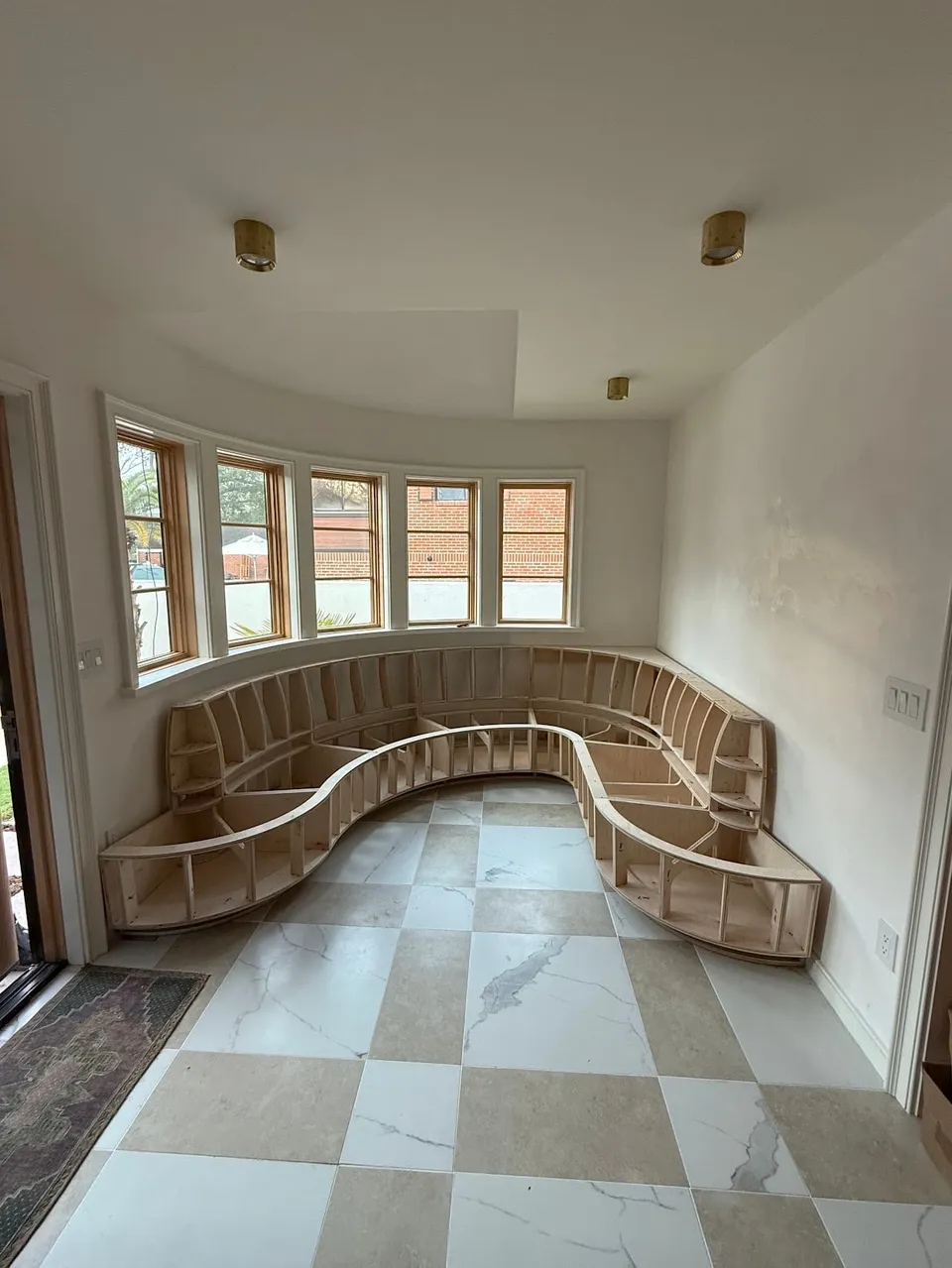 Custom-designed banquette frame, CNC-cut and assembled, prior to upholstery