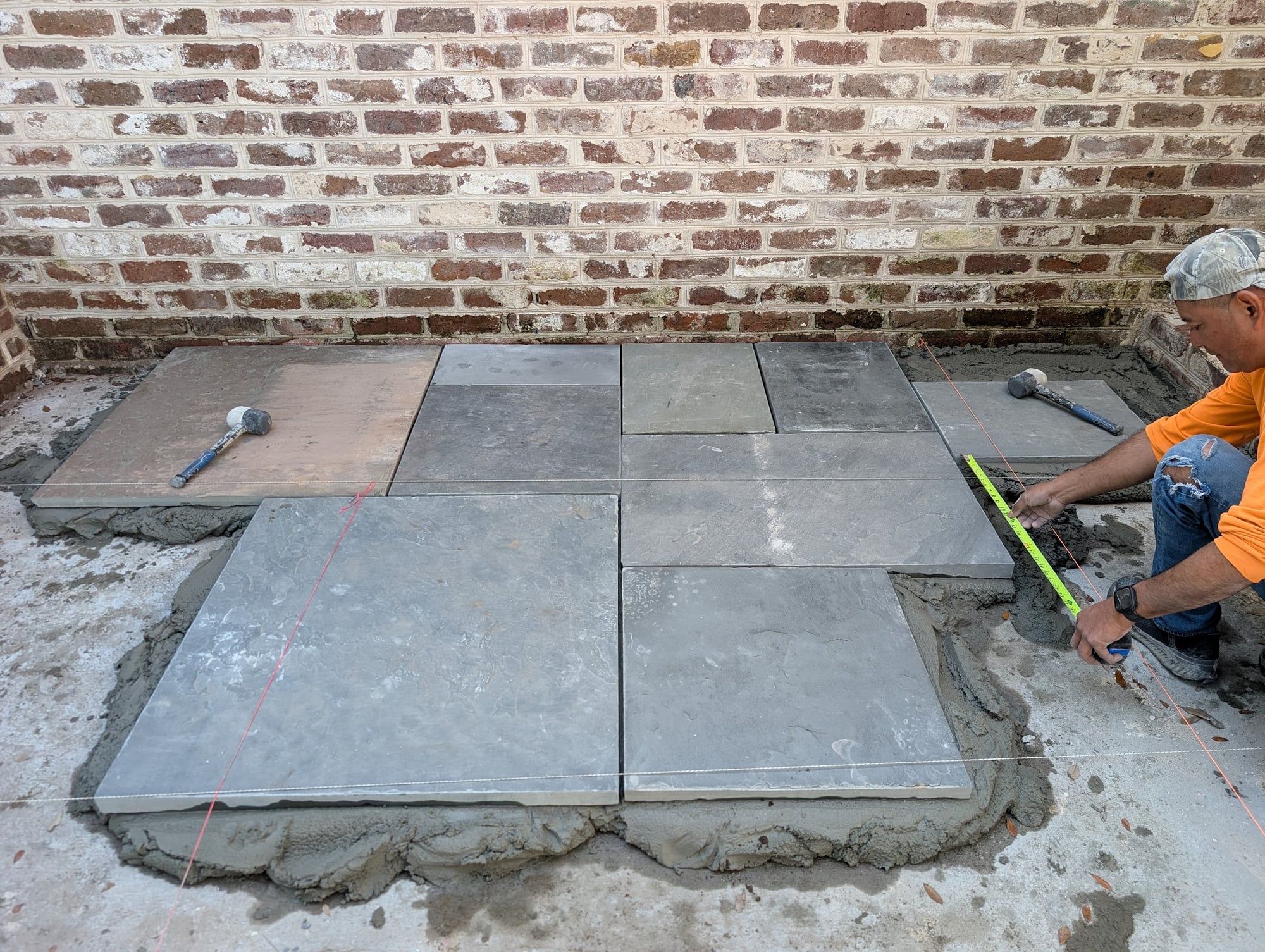 Hand-laid brick with mortar wash, copper gutters in progress