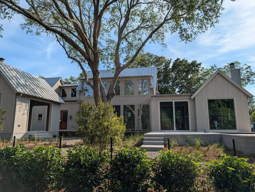 Modern custom home beneath live oak